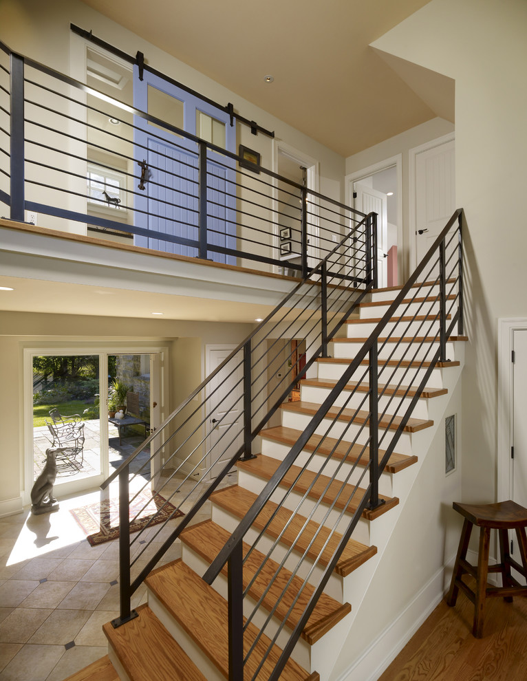 Transitional wood straight staircase in Philadelphia.