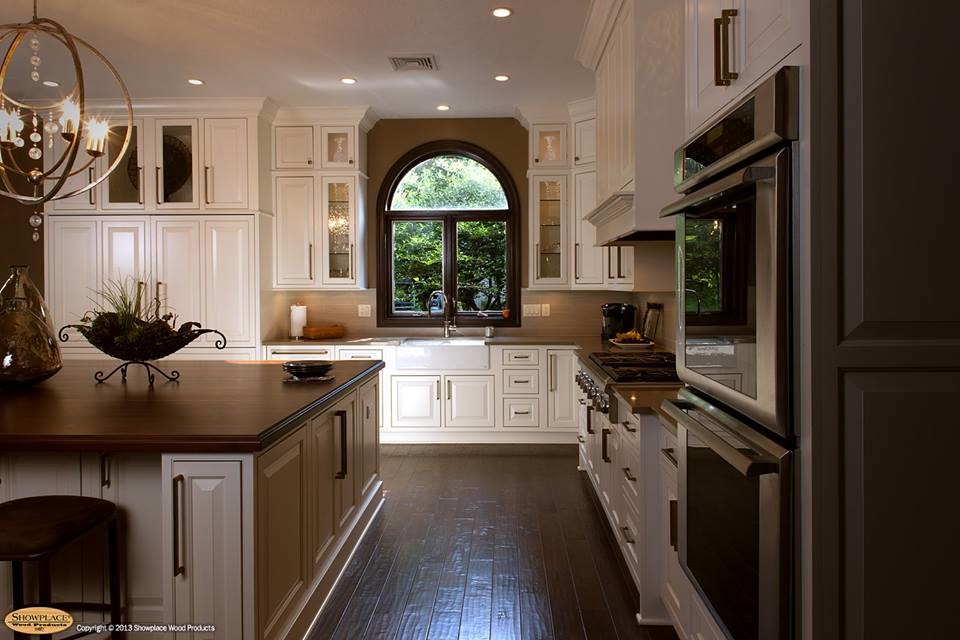 Inspiration for a transitional kitchen remodel in Other with an undermount sink, white cabinets and an island