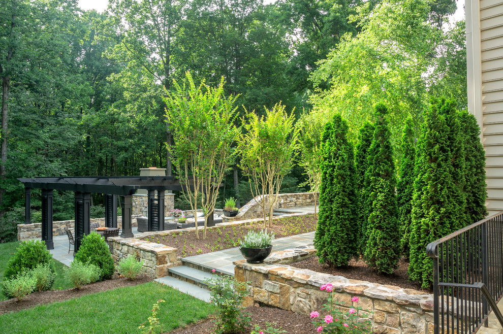 Inspiration for a contemporary backyard garden in Baltimore with natural stone pavers.