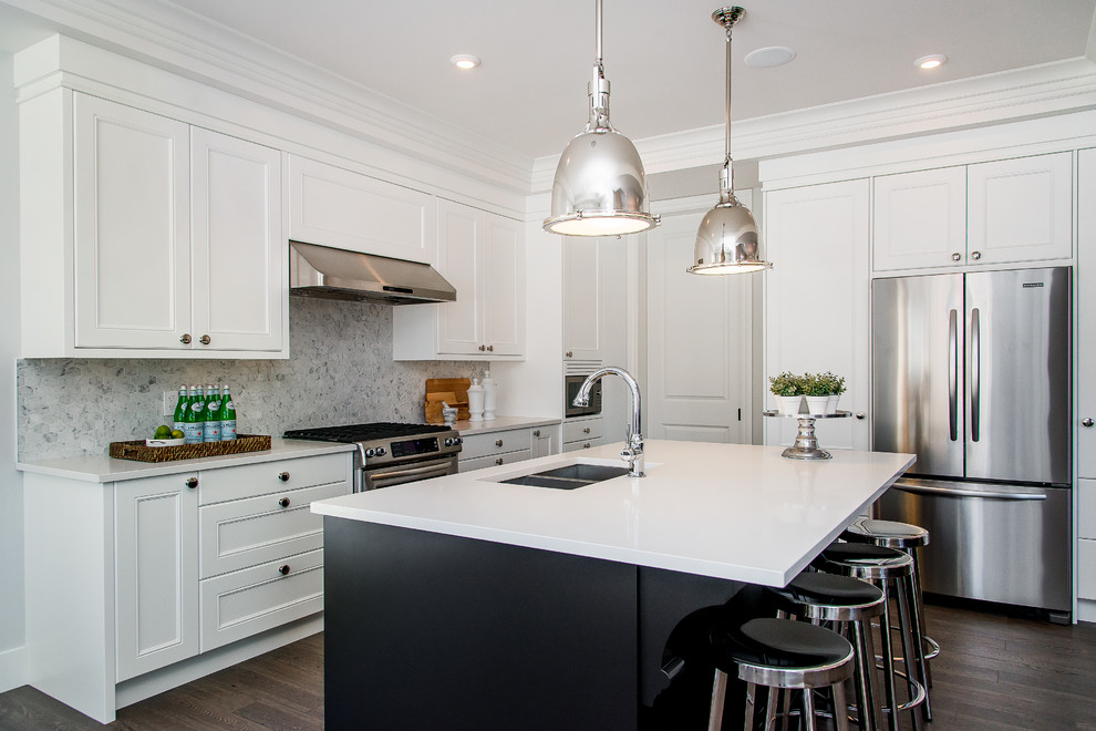 Large transitional l-shaped dark wood floor eat-in kitchen photo in Calgary with an undermount sink, recessed-panel cabinets, white cabinets, quartz countertops, multicolored backsplash, mosaic tile backsplash, stainless steel appliances and an island