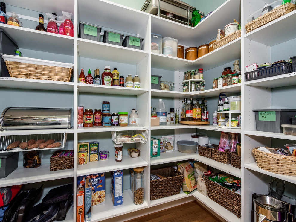 Photo of an expansive u-shaped kitchen pantry in Charlotte.