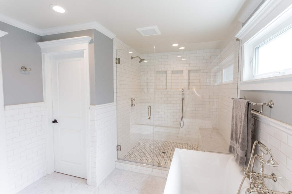 Photo of a country bathroom in San Francisco with shaker cabinets, white cabinets, a freestanding tub, a double shower, a two-piece toilet, gray tile, ceramic tile, grey walls, ceramic floors, an undermount sink, engineered quartz benchtops, white floor and a hinged shower door.
