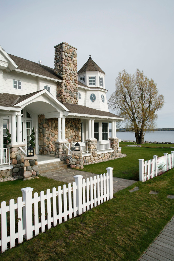 Beach style white two-story house exterior photo in Detroit