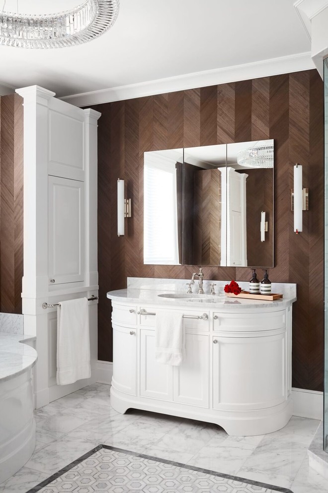 Inspiration for an expansive transitional master bathroom in Chicago with furniture-like cabinets, white cabinets, an undermount tub, white walls, marble floors, an undermount sink and marble benchtops.