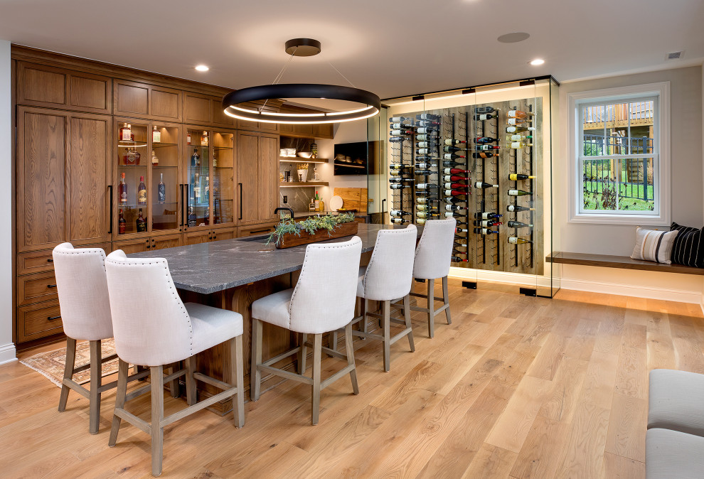 Photo of a large transitional home bar in Columbus.