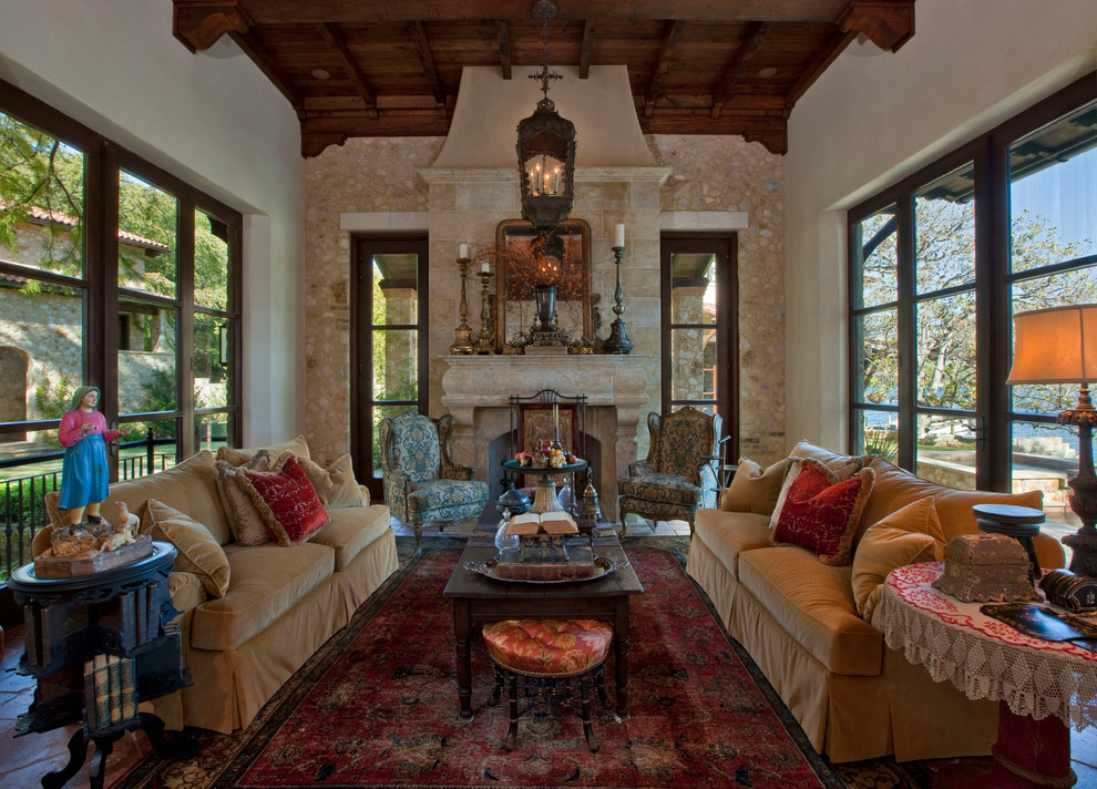Large mediterranean enclosed family room in Austin with white walls and a standard fireplace.