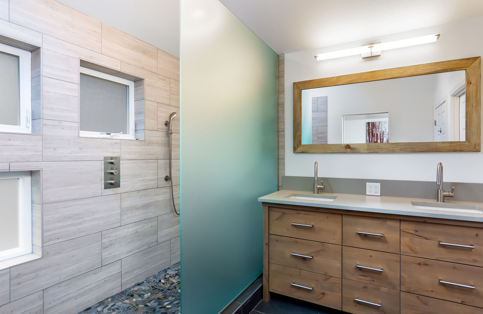Photo of an expansive contemporary kids bathroom in Other with flat-panel cabinets, an alcove tub, a shower/bathtub combo, a two-piece toilet, white tile, ceramic tile, white walls, ceramic floors, an integrated sink, glass benchtops, grey floor, a shower curtain, white benchtops, white cabinets, a single vanity and a floating vanity.