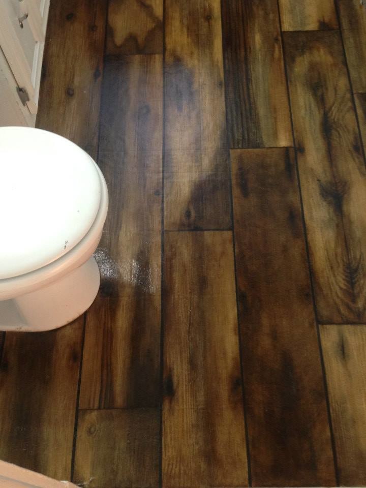 Design ideas for a country bathroom in Boston with painted wood floors.