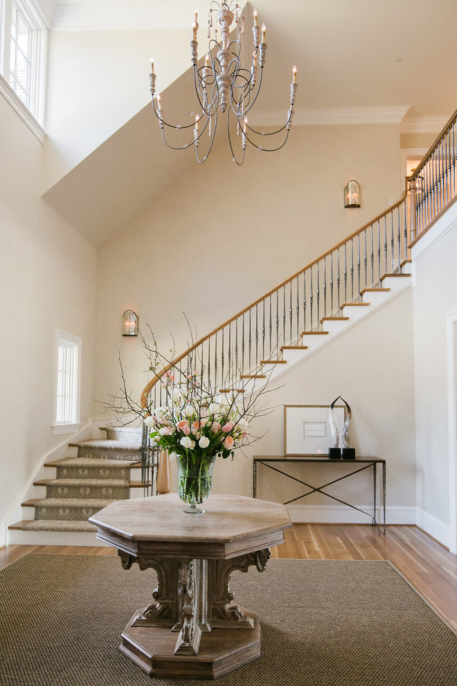 Inspiration for a mid-sized transitional medium tone wood floor and brown floor foyer remodel in Baltimore with beige walls