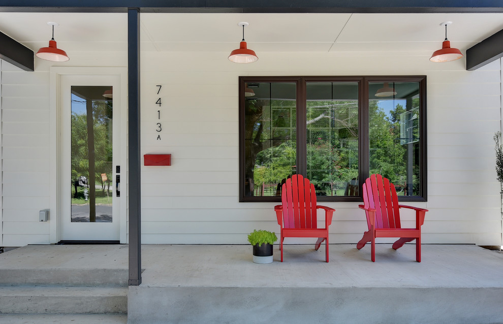 This is an example of a small country front door in Austin with a single front door and a glass front door.