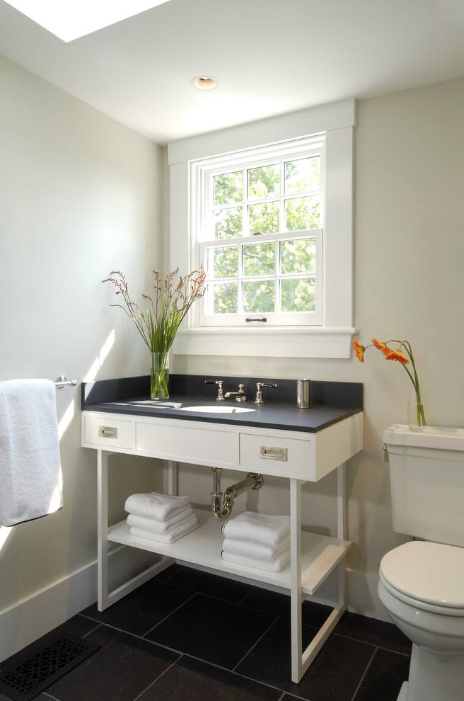 Contemporary bathroom in Boston with an undermount sink, open cabinets, white cabinets and black tile.