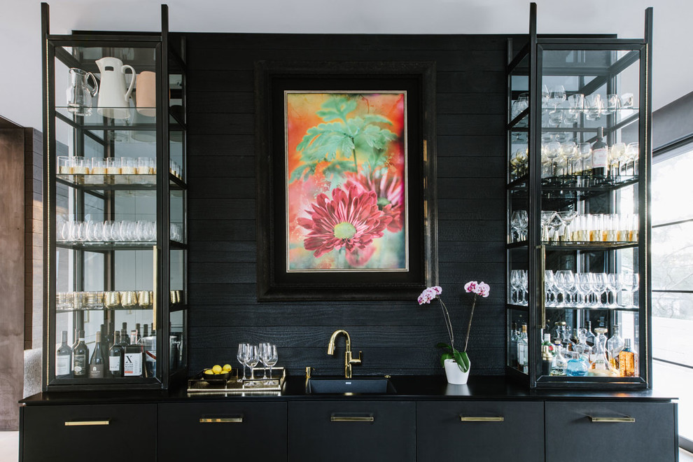 Photo of a large contemporary galley home bar in DC Metro with a drop-in sink, flat-panel cabinets, white cabinets, quartzite benchtops, multi-coloured splashback, light hardwood floors and white floor.