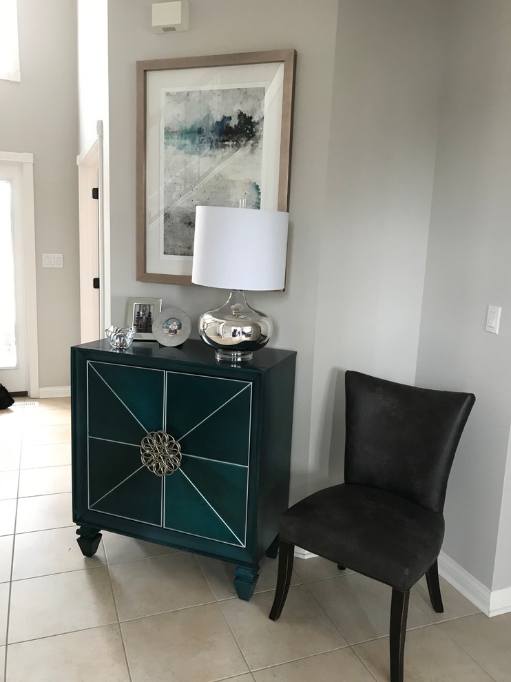 Mid-sized transitional entryway photo in Indianapolis with gray walls