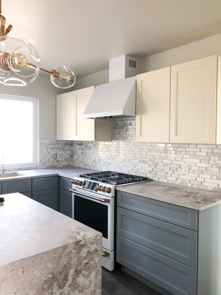 Photo of a small eclectic l-shaped eat-in kitchen in Other with an undermount sink, shaker cabinets, grey cabinets, quartz benchtops, multi-coloured splashback, marble splashback, white appliances, laminate floors, with island, brown floor and multi-coloured benchtop.