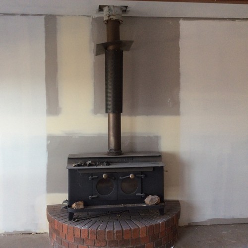 Tiling or painting behind wood burner