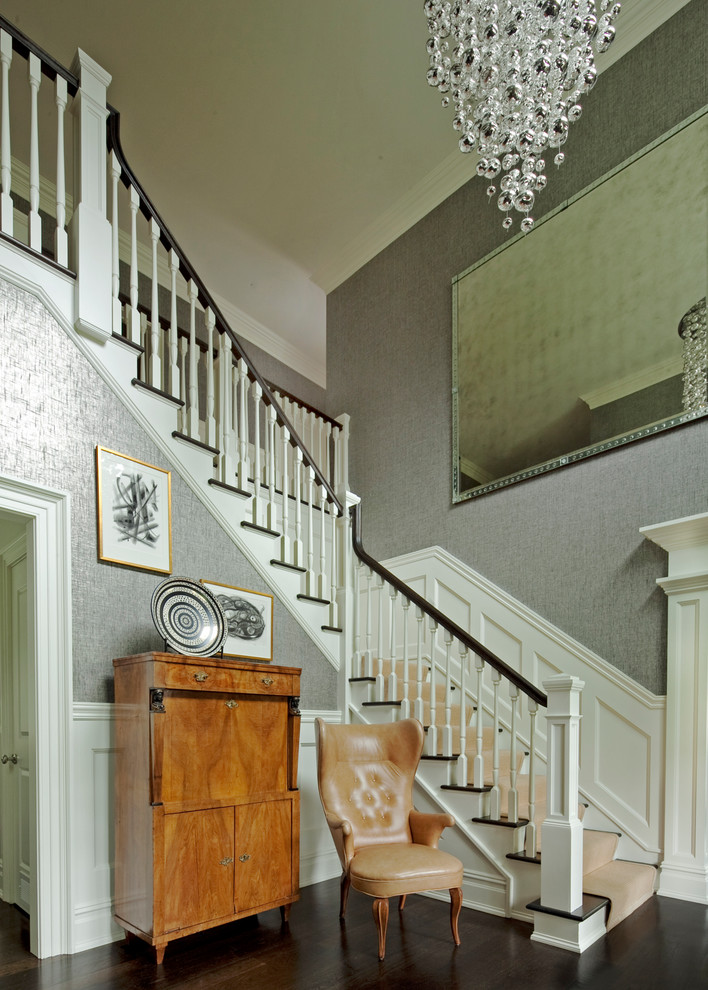 Example of a transitional wooden l-shaped dark wood floor staircase design in New York