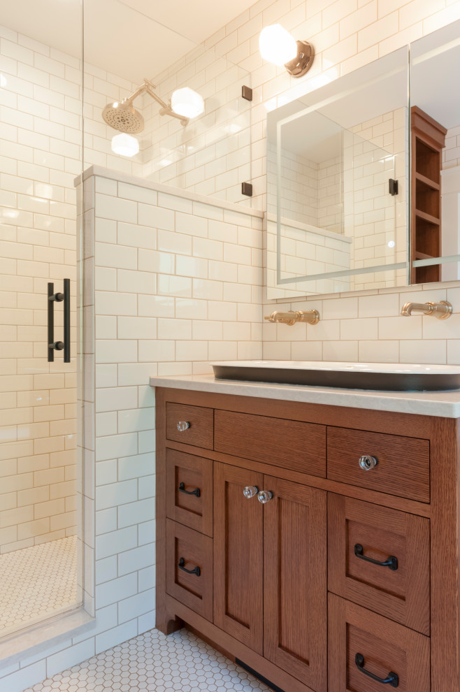Photo of a mid-sized arts and crafts master bathroom in Chicago with flat-panel cabinets, medium wood cabinets, an alcove shower, a one-piece toilet, white tile, subway tile, white walls, ceramic floors, a trough sink, engineered quartz benchtops, white floor, a hinged shower door, a shower seat, a single vanity and a built-in vanity.