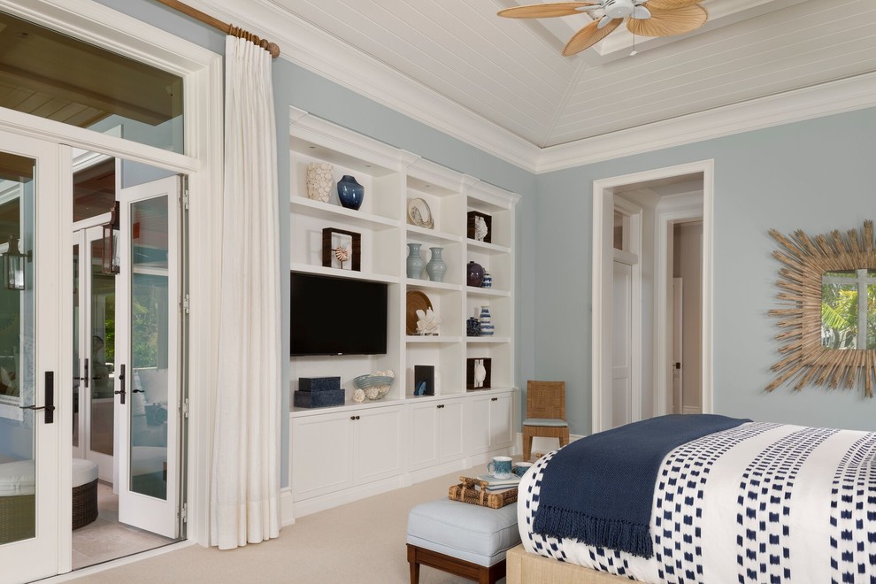 Inspiration for a large transitional master bedroom in Miami with blue walls, carpet and beige floor.