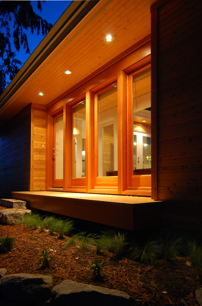 Design ideas for a small modern one-storey exterior in Vancouver with wood siding.