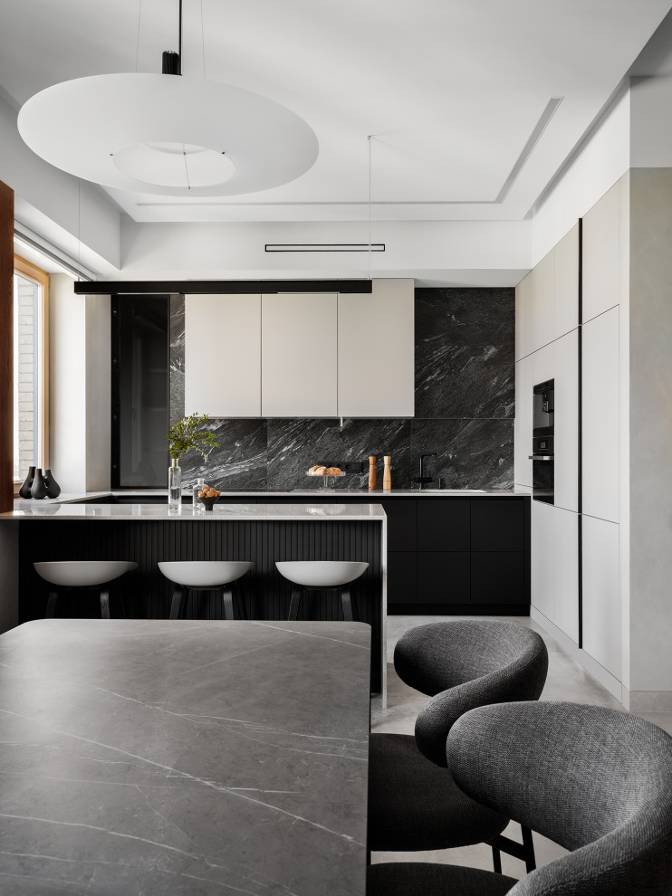 This is an example of a medium sized contemporary u-shaped open plan kitchen in Saint Petersburg with an integrated sink, flat-panel cabinets, beige cabinets, composite countertops, black splashback, porcelain splashback, black appliances, porcelain flooring, a breakfast bar, beige floors, beige worktops and exposed beams.