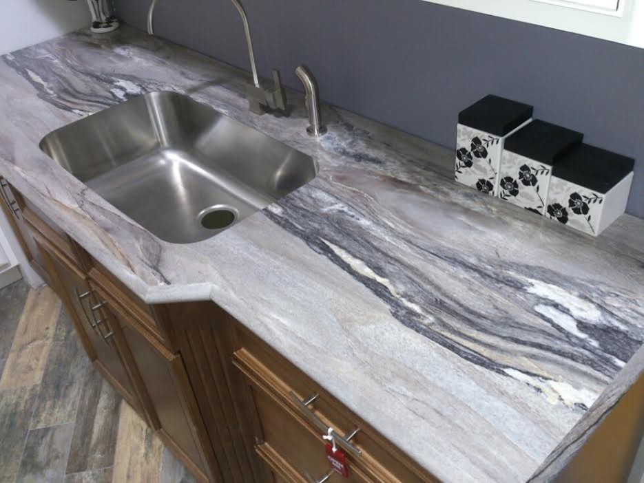 Enclosed kitchen - mid-sized transitional single-wall dark wood floor and brown floor enclosed kitchen idea in Chicago with an undermount sink, recessed-panel cabinets, medium tone wood cabinets, granite countertops, stainless steel appliances and no island