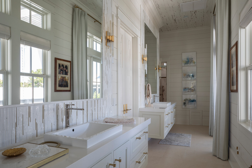 Example of a large beach style master white tile and mosaic tile ceramic tile, beige floor, double-sink, wood ceiling and shiplap wall alcove bathtub design in Other with recessed-panel cabinets, white cabinets, white walls, a drop-in sink, white countertops and a floating vanity