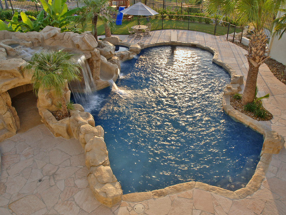 Photo of a tropical pool in Austin.