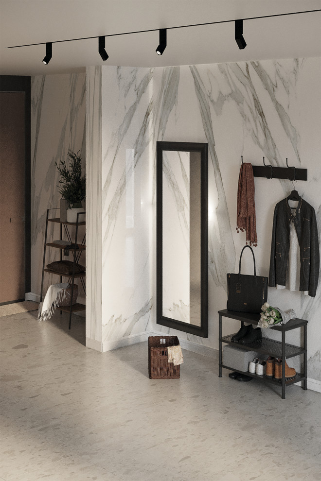 Réalisation d'une grande porte d'entrée minimaliste avec un mur blanc, sol en béton ciré, une porte simple, une porte marron, un sol gris et du lambris.