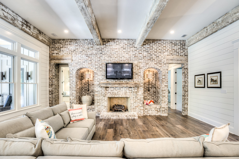 Design ideas for a country enclosed family room in Atlanta with white walls, a standard fireplace and a brick fireplace surround.