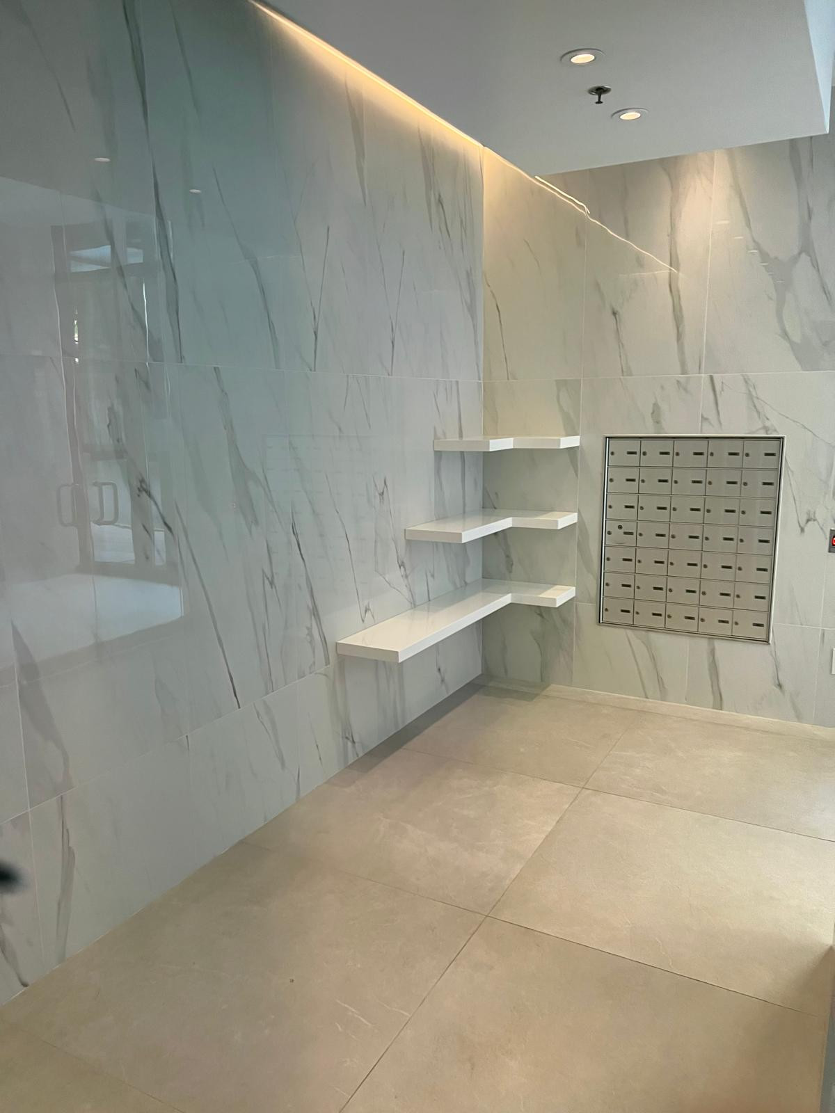 Demolition: Removal of old finishes, including flooring, walls, and outdated fixtures. The space is cleared to create a fresh start for the renovation.