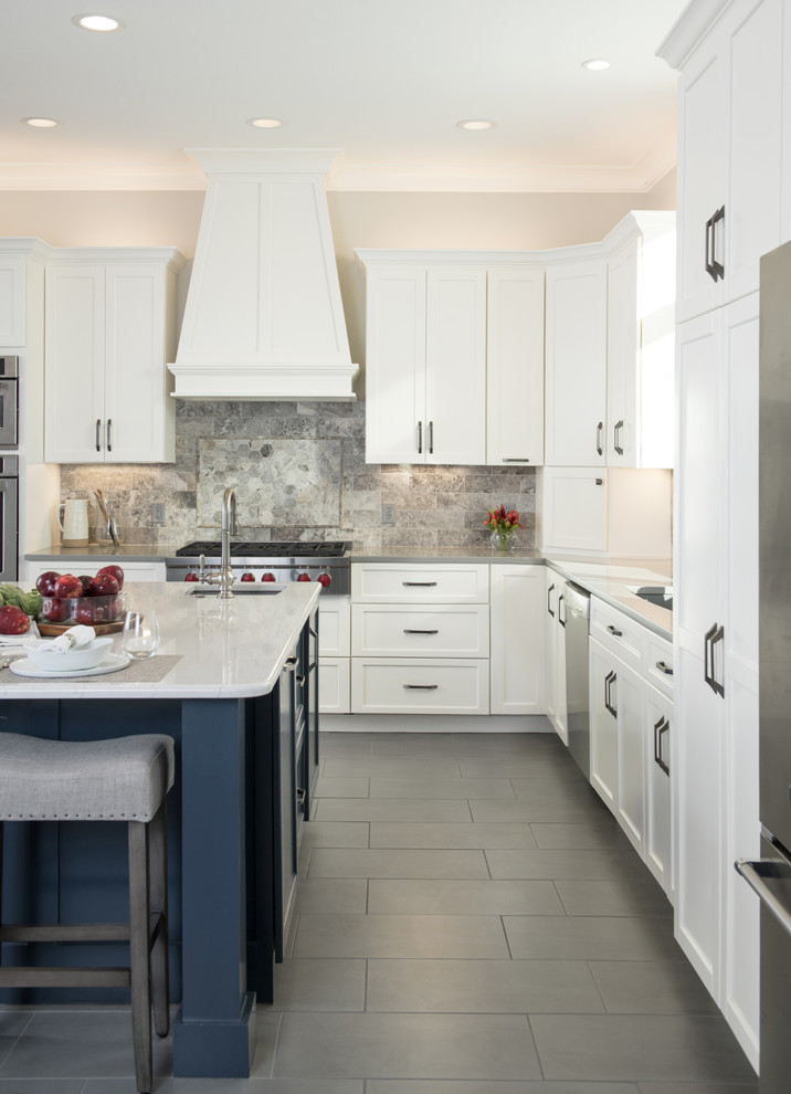 Design ideas for a large transitional l-shaped kitchen pantry in Kansas City with a single-bowl sink, shaker cabinets, white cabinets, quartz benchtops, grey splashback, stone tile splashback, stainless steel appliances, porcelain floors, with island, grey floor and white benchtop.