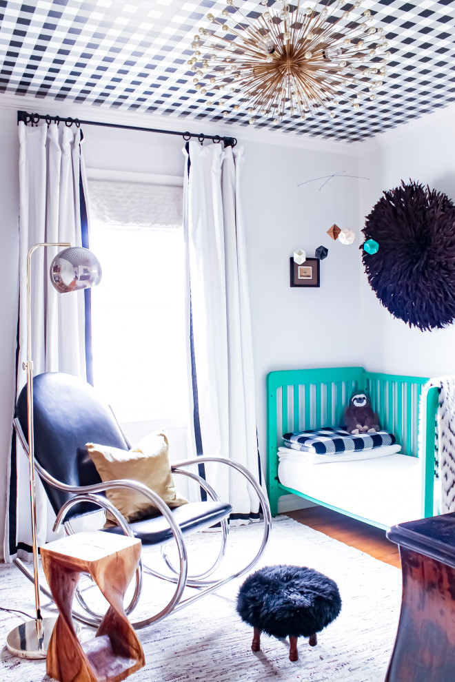 Inspiration for an eclectic kids' room for boys in Kansas City with white walls, medium hardwood floors and wallpaper.