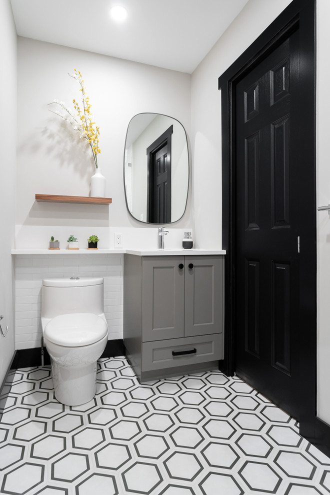 Mid-sized transitional kids bathroom in Vancouver with shaker cabinets, grey cabinets, a one-piece toilet, white walls, an undermount sink, multi-coloured floor, white benchtops, a single vanity, a built-in vanity, an open shower, white tile, porcelain tile, porcelain floors, engineered quartz benchtops, an open shower and a niche.