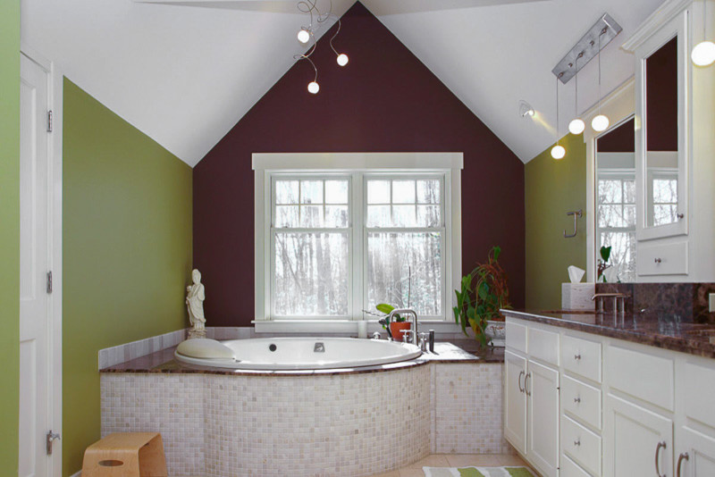 Example of a large transitional master white tile beige floor drop-in bathtub design in Denver with recessed-panel cabinets, white cabinets, green walls and an undermount sink
