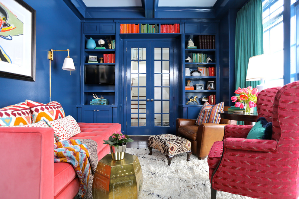 Photo of an eclectic home office in Chicago with blue walls and dark hardwood floors.