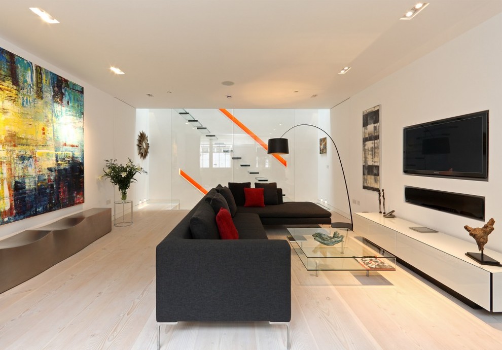 Photo of a mid-sized modern living room in London with white walls, a ribbon fireplace, a plaster fireplace surround, a built-in media wall and white floor.