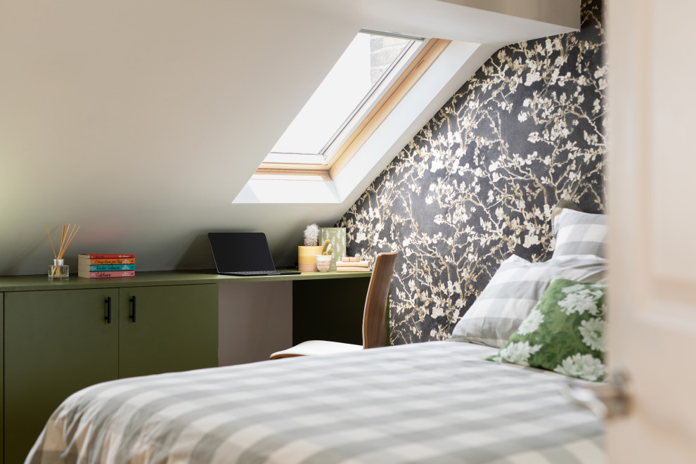 Photo of a mid-sized contemporary bedroom in London with green walls, carpet, grey floor and wallpaper.