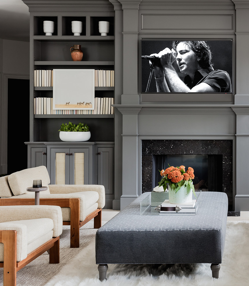 Inspiration for a transitional open concept family room with white walls, light hardwood floors, a standard fireplace, a stone fireplace surround, a built-in media wall and grey floor.