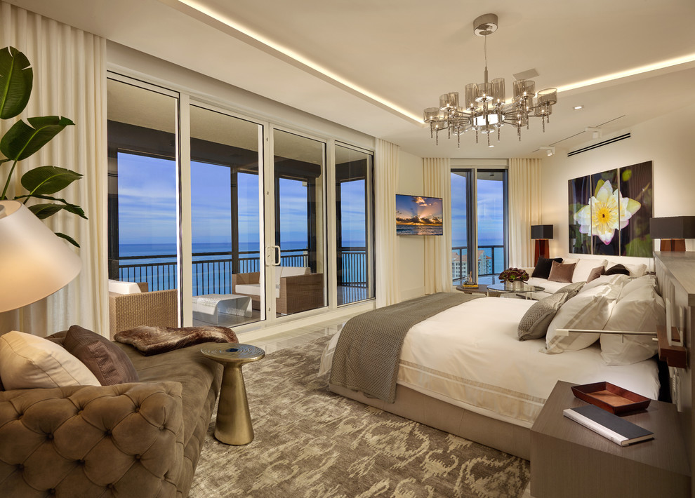 Design ideas for a transitional master bedroom in Miami with white walls.