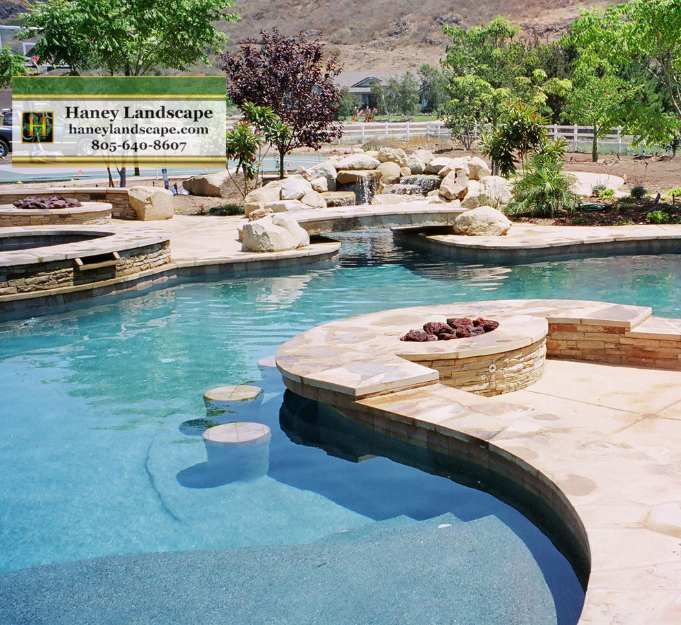 Inspiration for a large contemporary backyard pool in Santa Barbara with stamped concrete.
