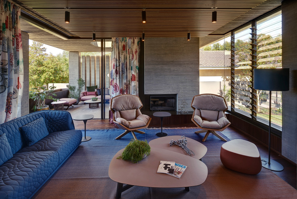 Mid-sized midcentury living room in Perth with grey walls and a two-sided fireplace.