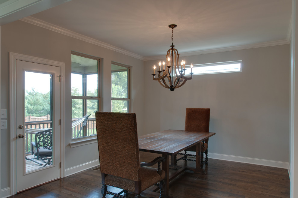 Mid-sized country separate dining room in Nashville with grey walls, dark hardwood floors and brown floor.