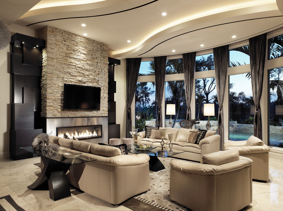 Photo of a large contemporary open concept living room in Miami with beige walls, limestone floors, a ribbon fireplace, a metal fireplace surround and a wall-mounted tv.