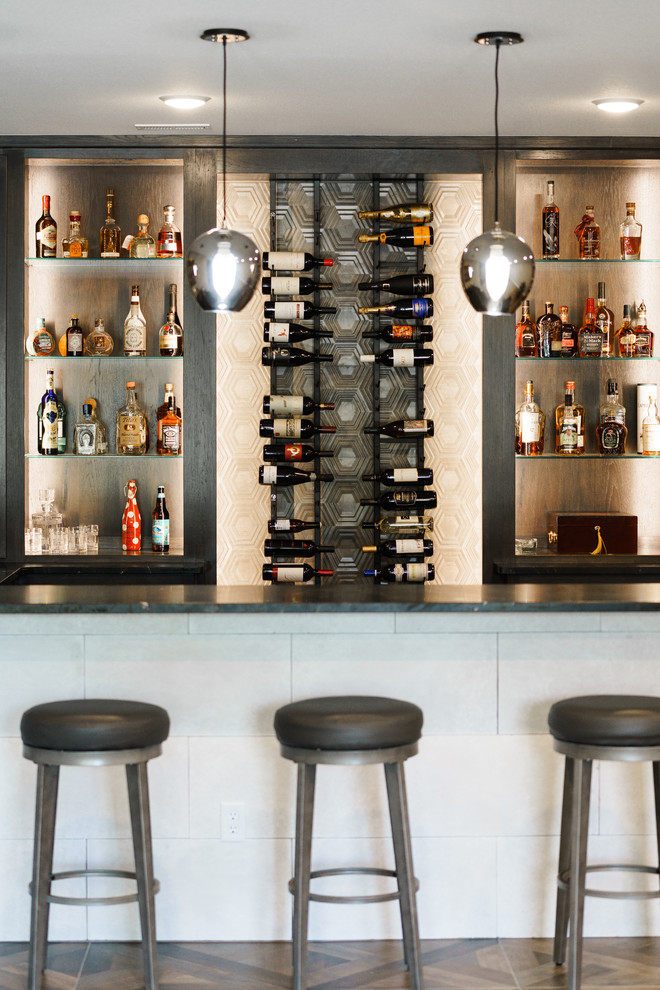Inspiration for a contemporary seated home bar in Wichita with open cabinets, dark wood cabinets, multi-coloured splashback, brown floor and black benchtop.