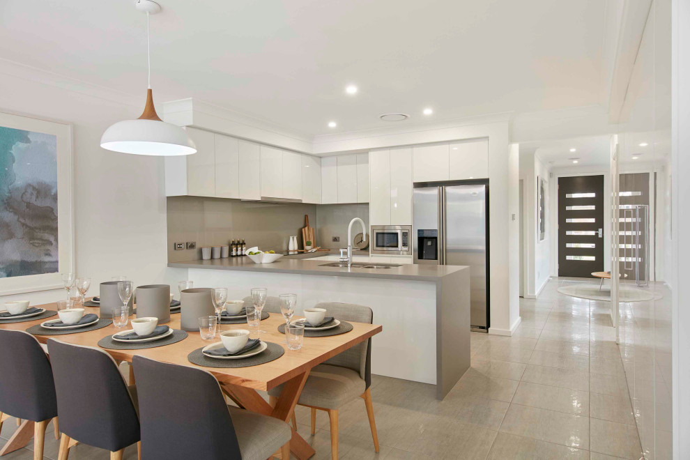 Design ideas for a contemporary open plan dining in Sydney with no fireplace, white walls and beige floor.