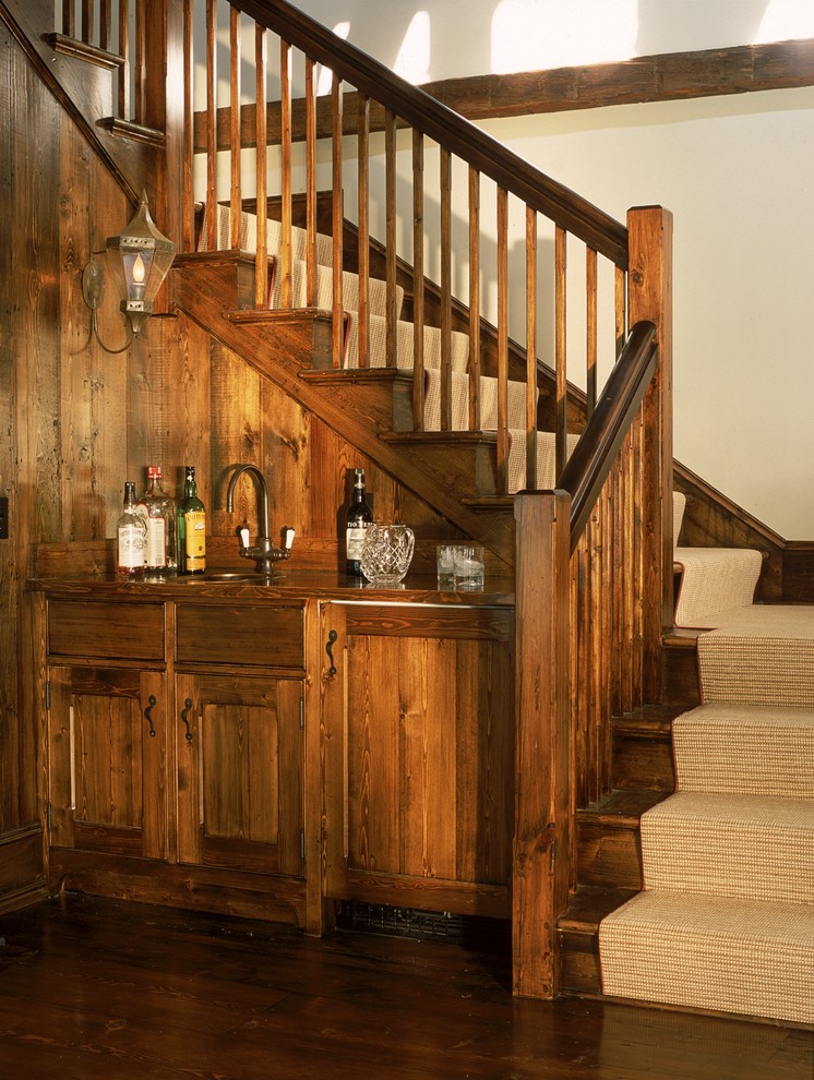This is an example of a traditional wood l-shaped staircase in New York with wood risers.