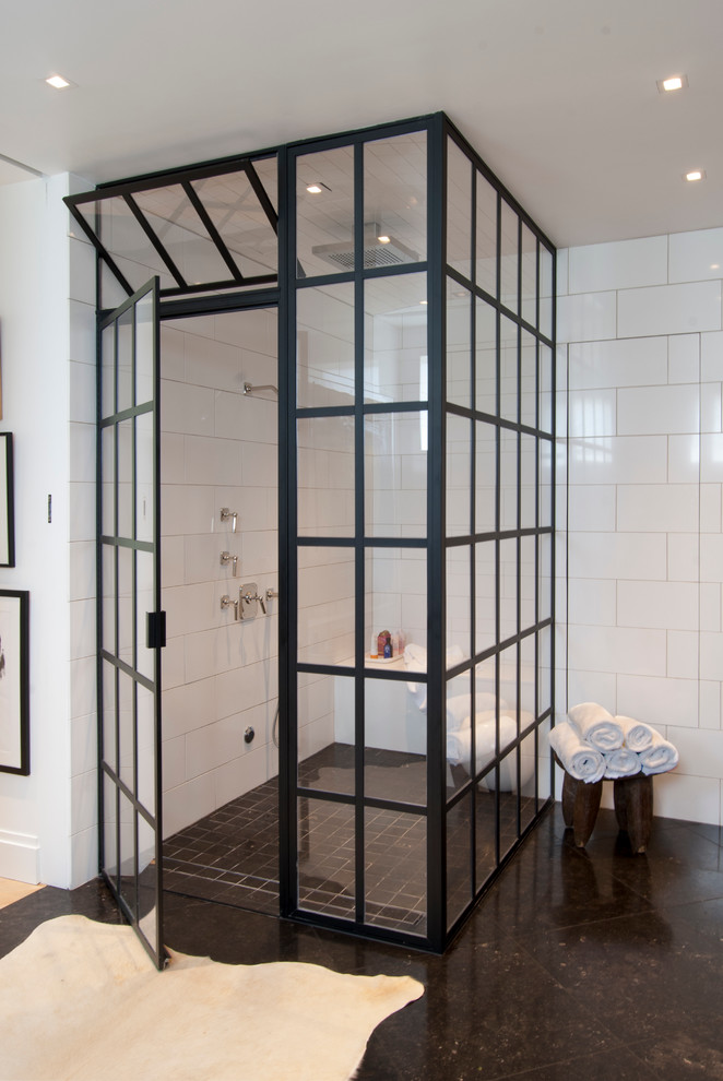 Photo of a mid-sized contemporary master bathroom in Other with an undermount sink, a corner shower, a two-piece toilet, white tile, stone tile, white walls and limestone floors.
