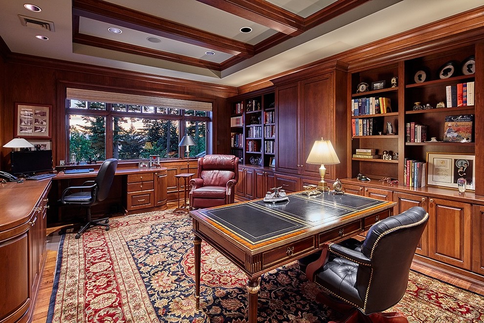Traditional study room in Seattle with brown walls, medium hardwood floors, no fireplace, a freestanding desk and brown floor.
