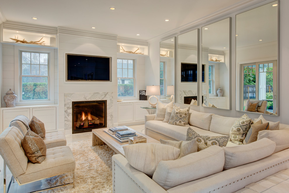 Photo of a mid-sized contemporary open concept family room in New York with white walls, a standard fireplace, a built-in media wall and a stone fireplace surround.
