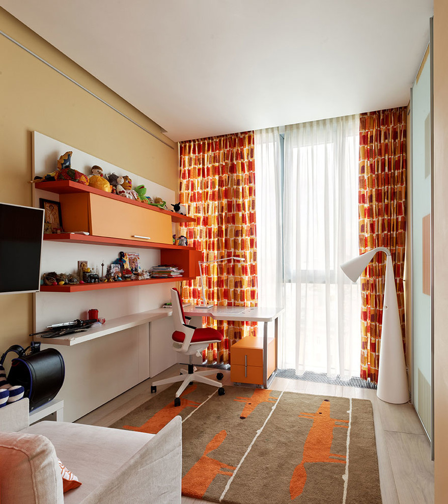 Photo of a mid-sized contemporary kids' room for boys in Moscow with yellow walls and light hardwood floors.